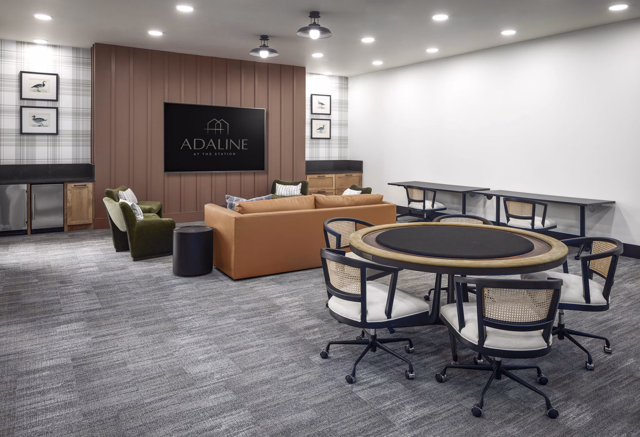 Modern clubhouse featuring luxury seating and entertainment spaces at Adaline at the Station Apartments