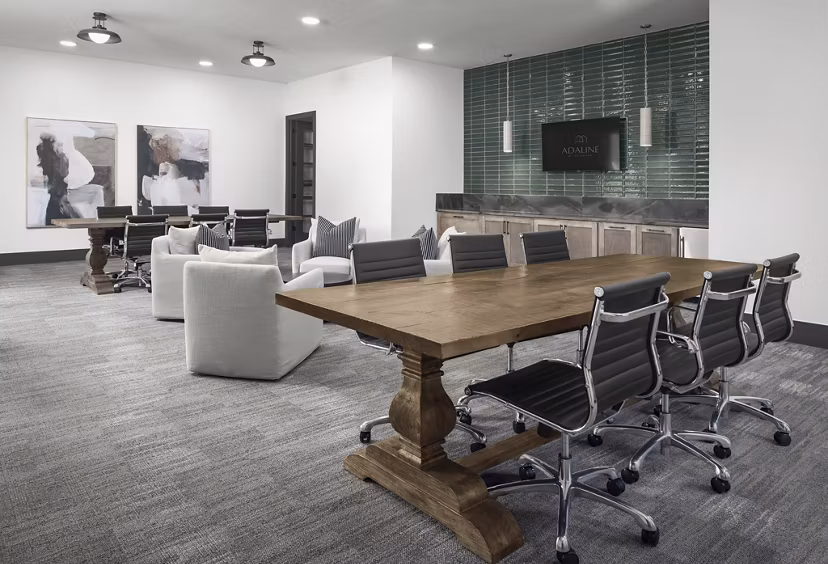Clubhouse featuring modern decor and ample seating at Adaline at the Station Apartments