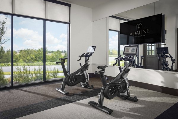 Yoga and spin studio with state-of-the-art equipment at Adaline at the Station Apartments offering luxury fitness amenities