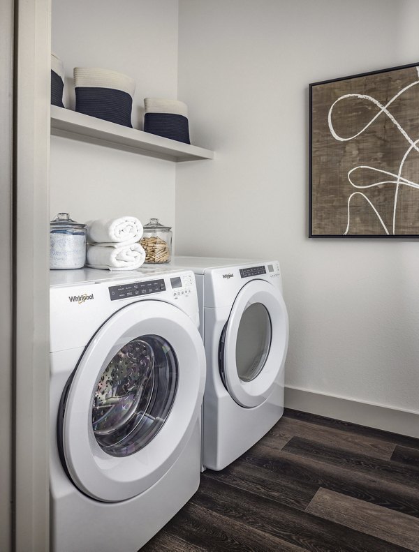 laundry room at Adaline at the Station Apartments