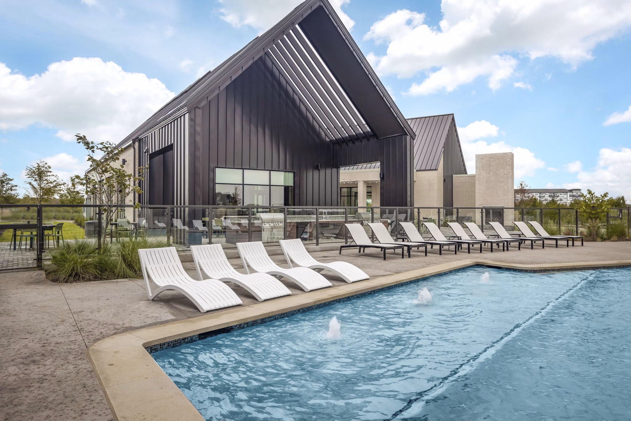 Resort-style pool at Adaline at the Station Apartments offering a luxurious retreat for relaxation and socializing