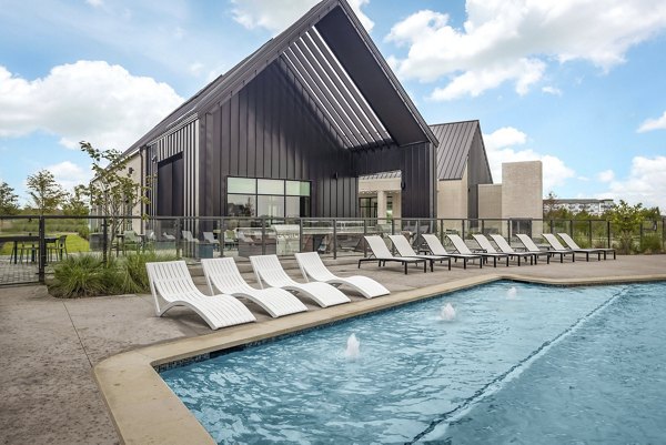 Resort-style pool at Adaline at the Station Apartments offering a luxurious retreat for relaxation and socializing