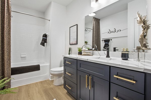 Modern bathroom with sleek fixtures at Adara at Godley Station Apartments luxurious living