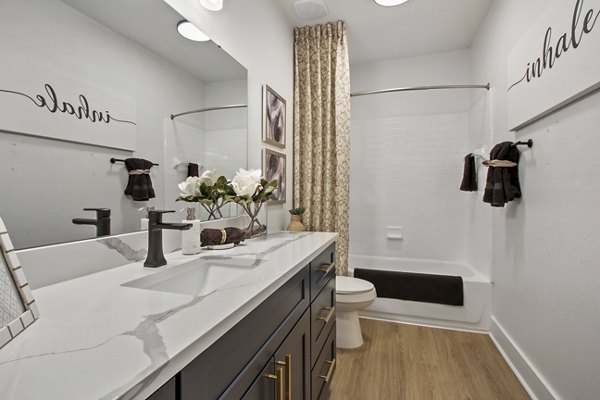 Bathroom featuring modern fixtures at Adara at Godley Station Apartments