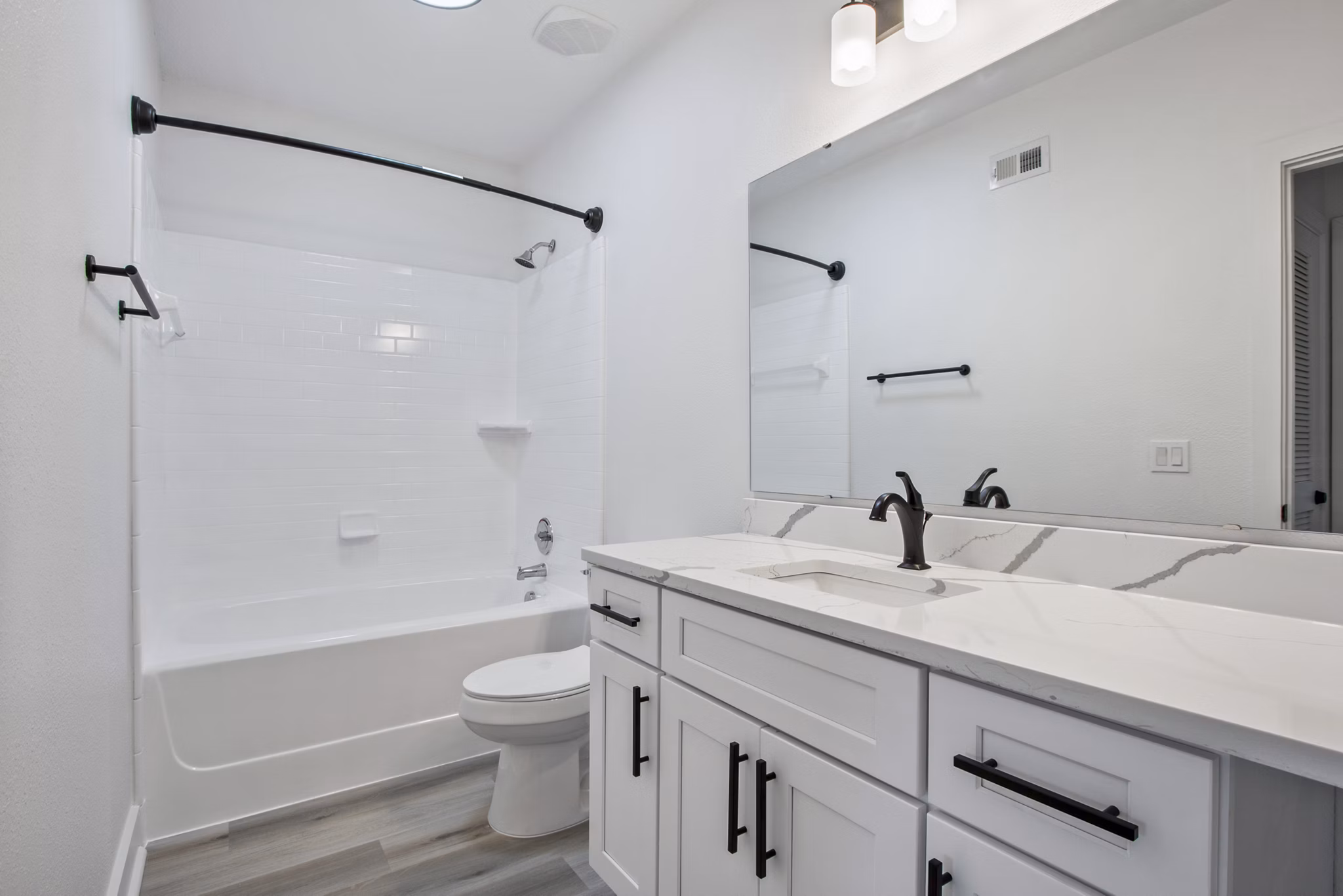 Elegant bathroom with modern fixtures in Adara at Godley Station Apartments