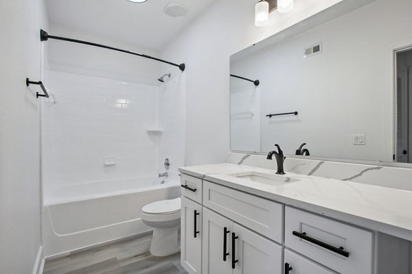 Elegant bathroom with modern fixtures in Adara at Godley Station Apartments