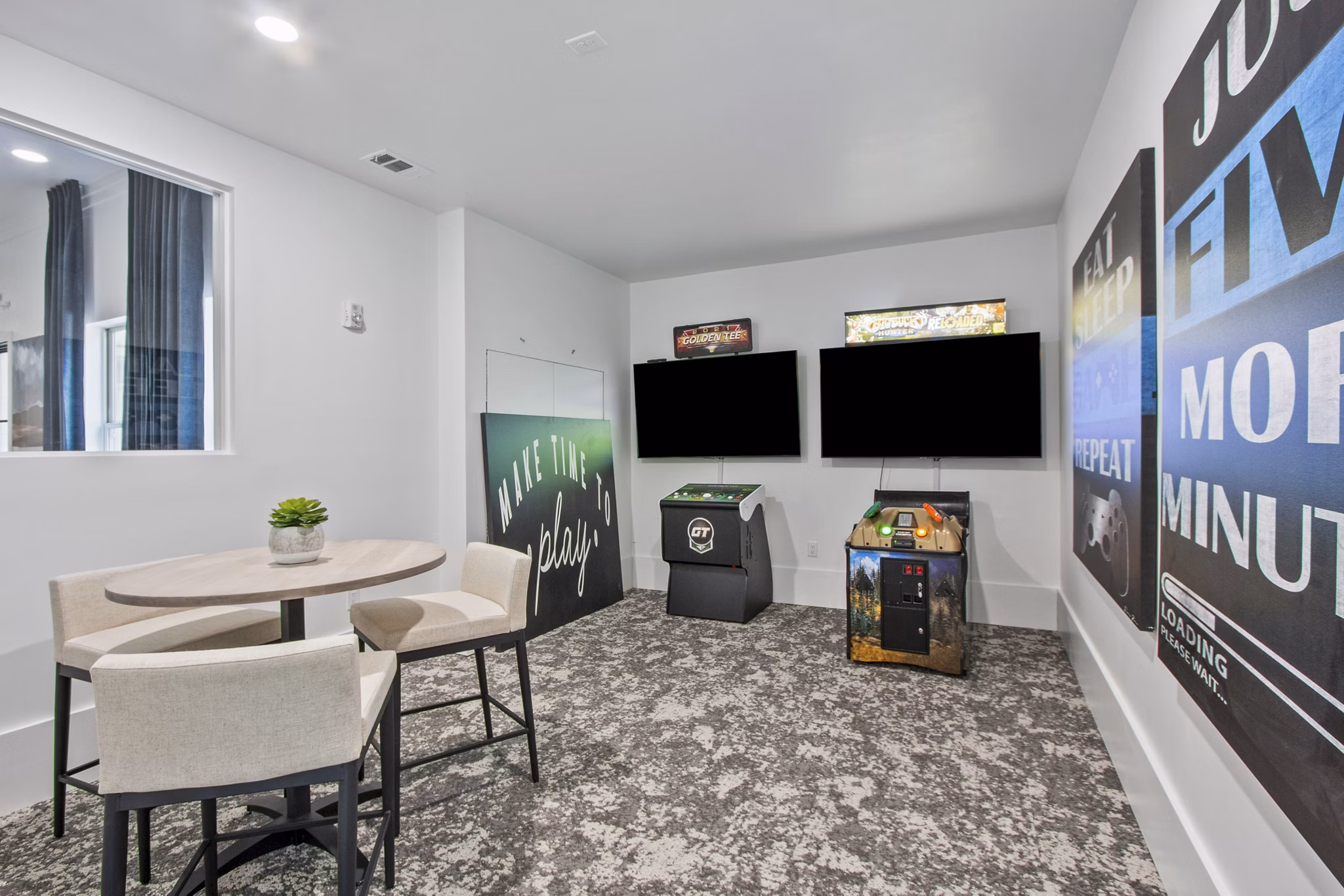 Game room with billiards and arcade games at Adara at Godley Station Apartments offering entertainment and fun for residents