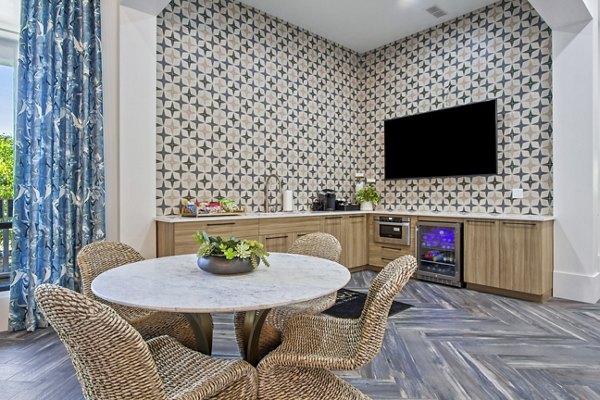 Modern clubhouse at Adara at Godley Station Apartments featuring stylish seating and contemporary design elements