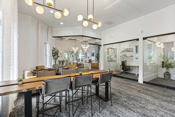 Elegant clubhouse interior with plush seating and modern decor at Adara at Godley Station Apartments