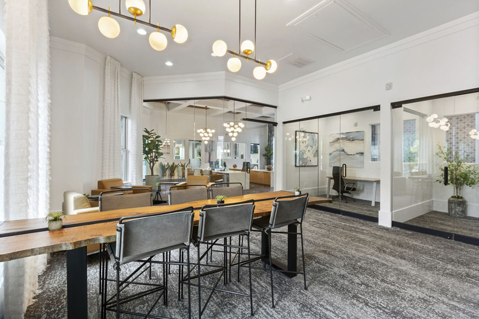 Elegant clubhouse interior with plush seating and modern decor at Adara at Godley Station Apartments
