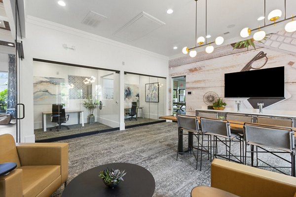 Clubhouse featuring stylish seating and entertainment options at Adara at Godley Station Apartments