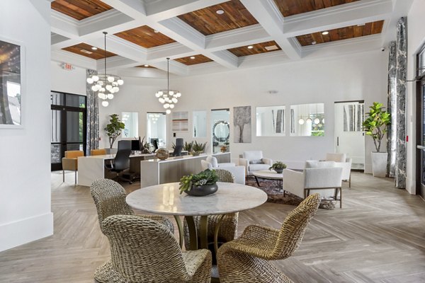 Elegant clubhouse with modern design at Adara at Godley Station Apartments, highlighting luxury living spaces and community charm