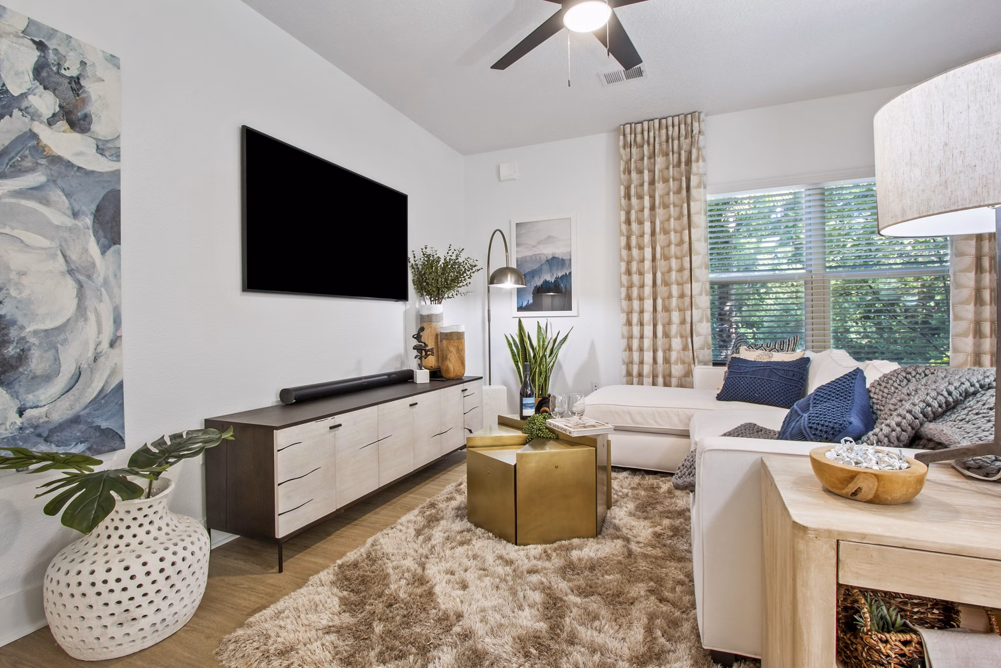 Spacious living room with modern furnishings in Adara at Godley Station Apartments