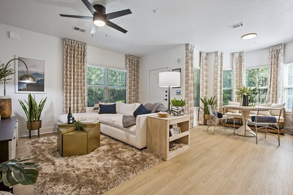 Spacious living room with modern decor at Adara at Godley Station Apartments