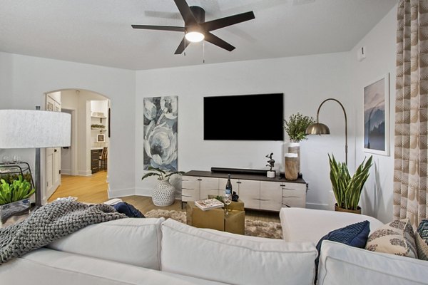 Cozy living room with modern furnishings in Adara at Godley Station Apartments