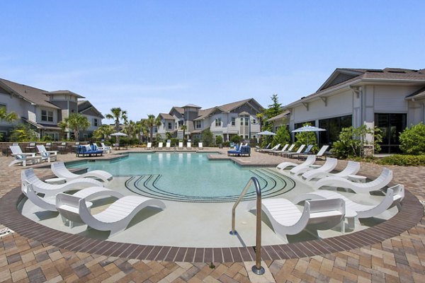 Luxurious poolside lounging at Adara at Godley Station Apartments