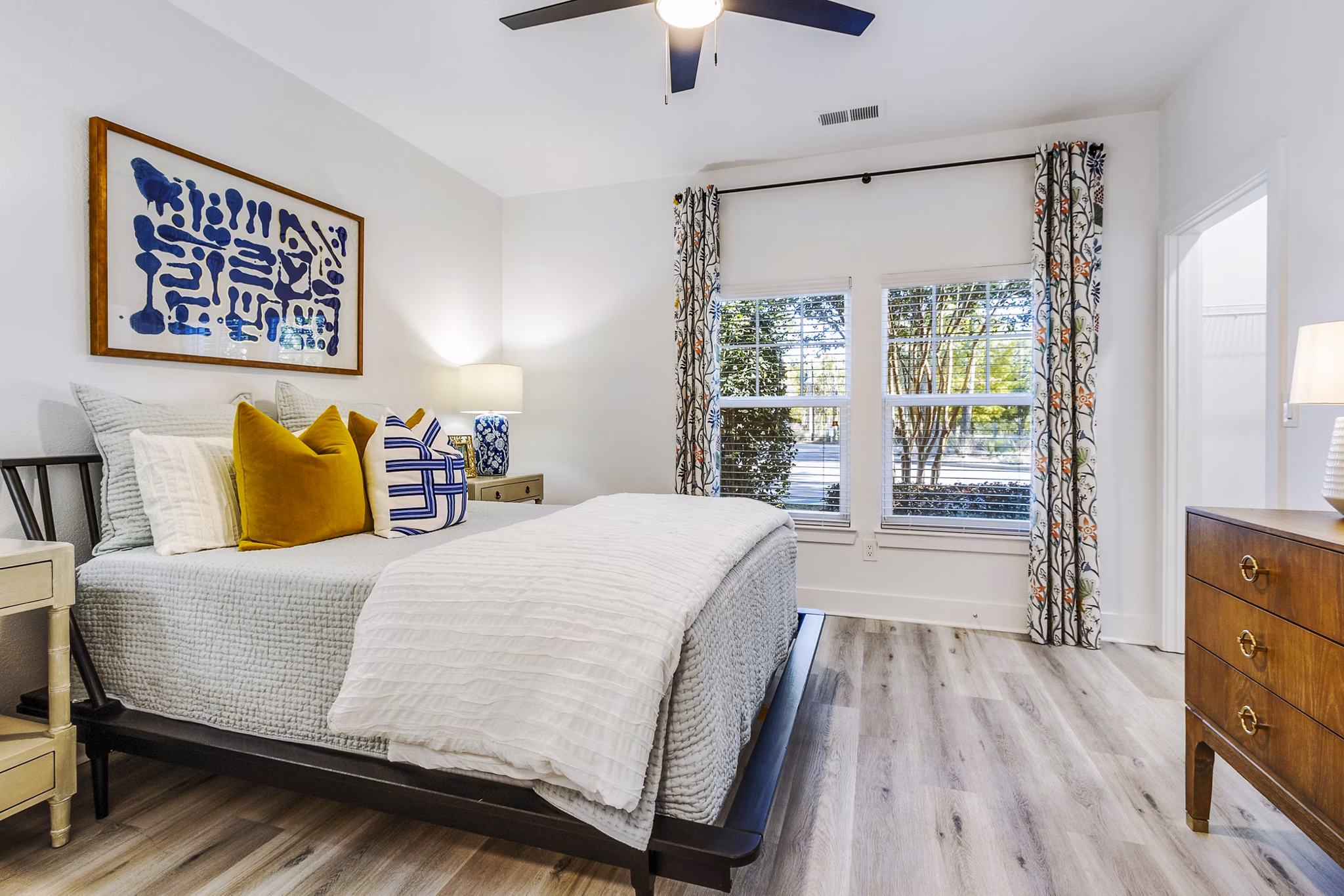 Cozy bedroom with elegant decor at The Avenues at Verdier Pointe Apartments