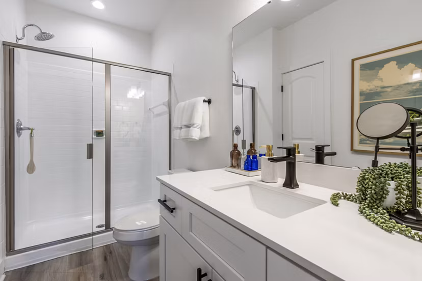 Luxurious bathroom with marble finishes at The Avenues at Verdier Pointe Apartments
