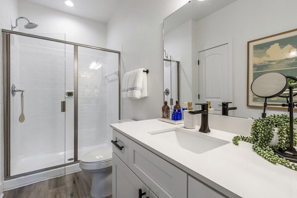 Luxurious bathroom with marble finishes at The Avenues at Verdier Pointe Apartments