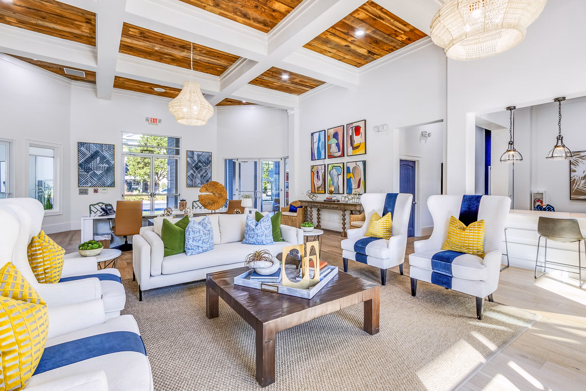 Clubhouse featuring modern design and spacious seating at The Avenues at Verdier Pointe Apartments