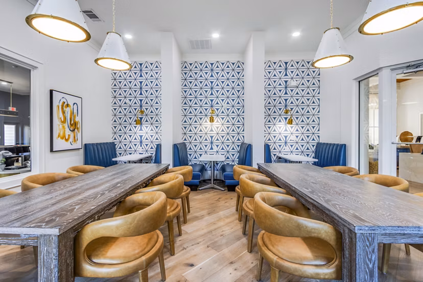 Contemporary clubhouse at The Avenues at Verdier Pointe Apartments with stylish seating and modern decor, ideal for social gatherings