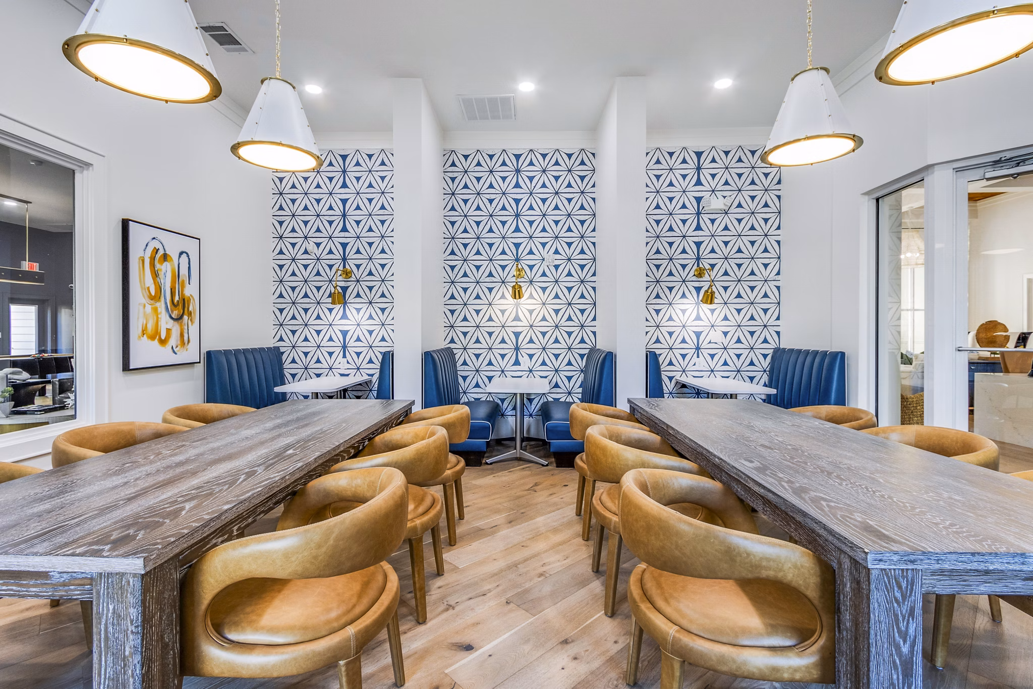 Contemporary clubhouse at The Avenues at Verdier Pointe Apartments with stylish seating and modern decor, ideal for social gatherings