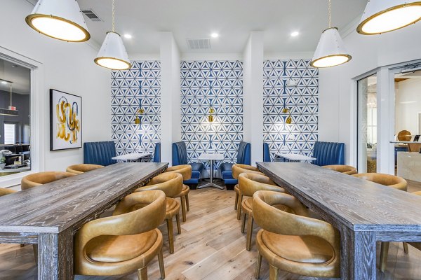 Contemporary clubhouse at The Avenues at Verdier Pointe Apartments with stylish seating and modern decor, ideal for social gatherings