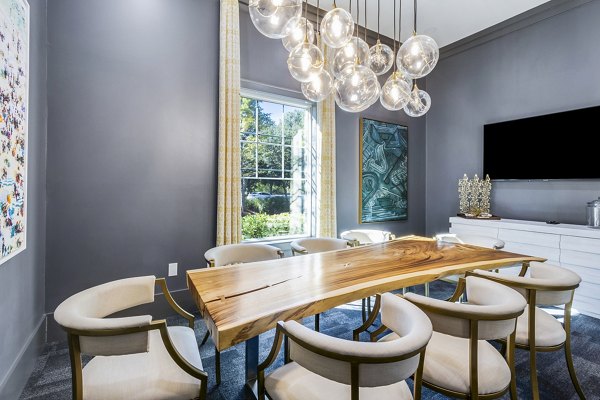 Modern clubhouse meeting facility at The Avenues at Verdier Pointe Apartments offering luxurious amenities for residents