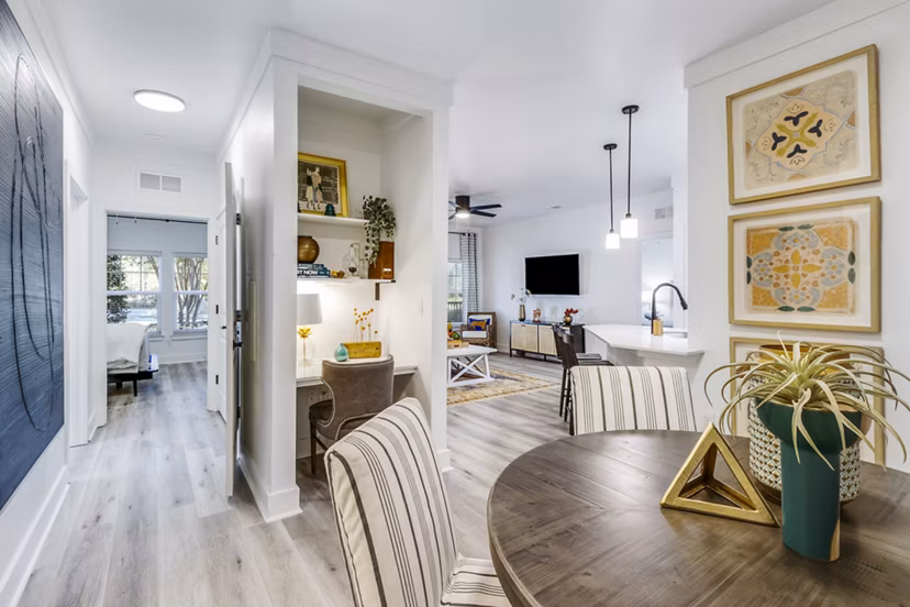 Dining area with elegant table setting at The Avenues at Verdier Pointe Apartments, offering a luxurious ambiance and modern design