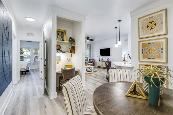 Dining area with elegant table setting at The Avenues at Verdier Pointe Apartments, offering a luxurious ambiance and modern design