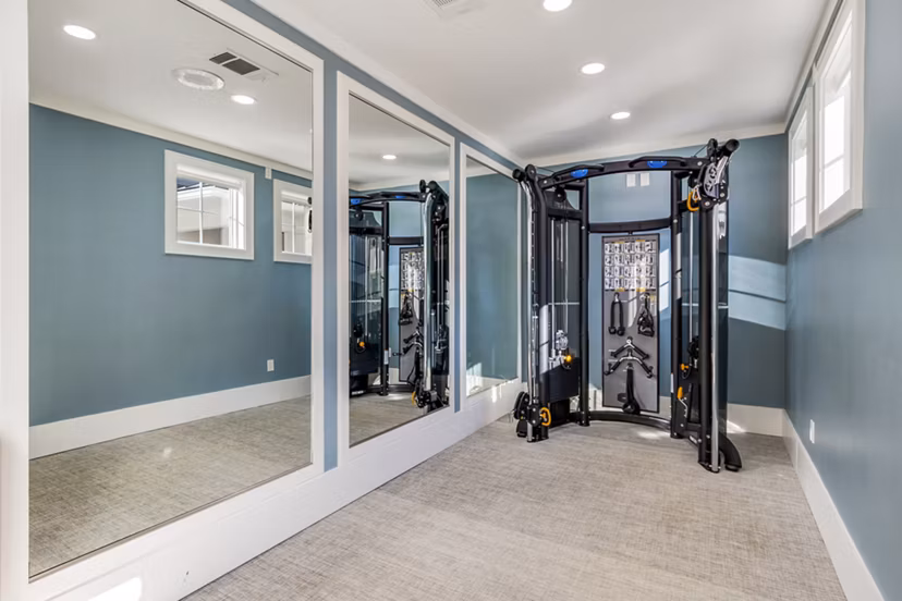 Fitness center with state-of-the-art equipment at The Avenues at Verdier Pointe Apartments for luxury living