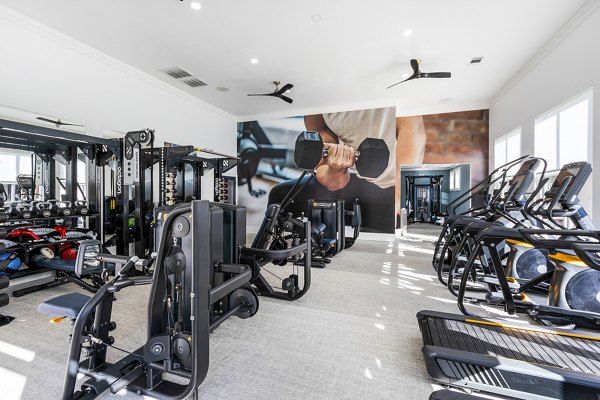 Fitness center with modern equipment at The Avenues at Verdier Pointe Apartments