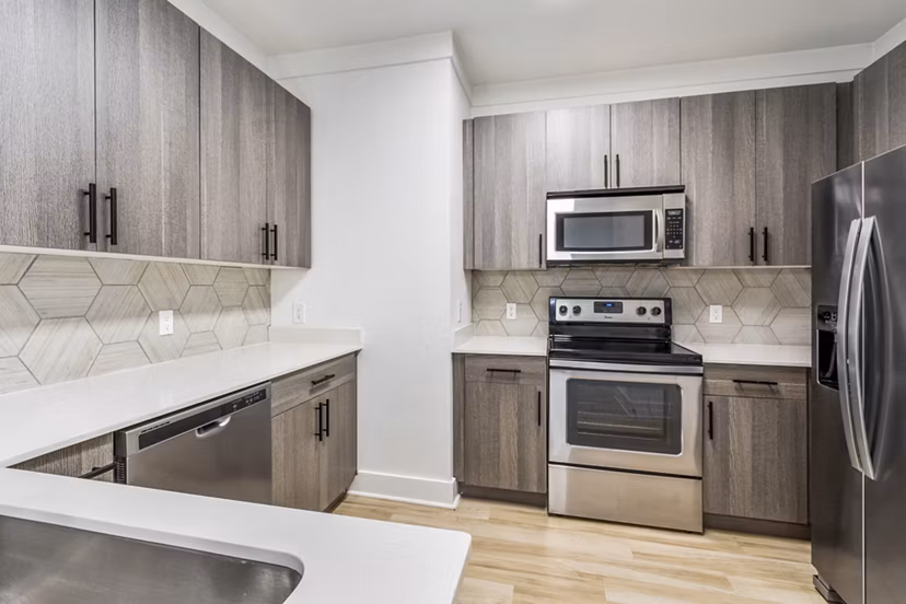 Modern kitchen with stainless steel appliances at The Avenues at Verdier Pointe Apartments, reflecting luxury living in a Greystar community