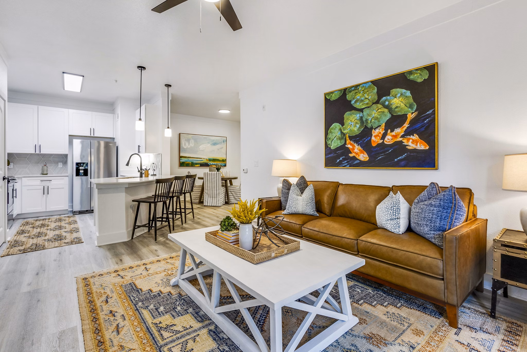 Spacious living room with modern furnishings in The Avenues at Verdier Pointe Apartments