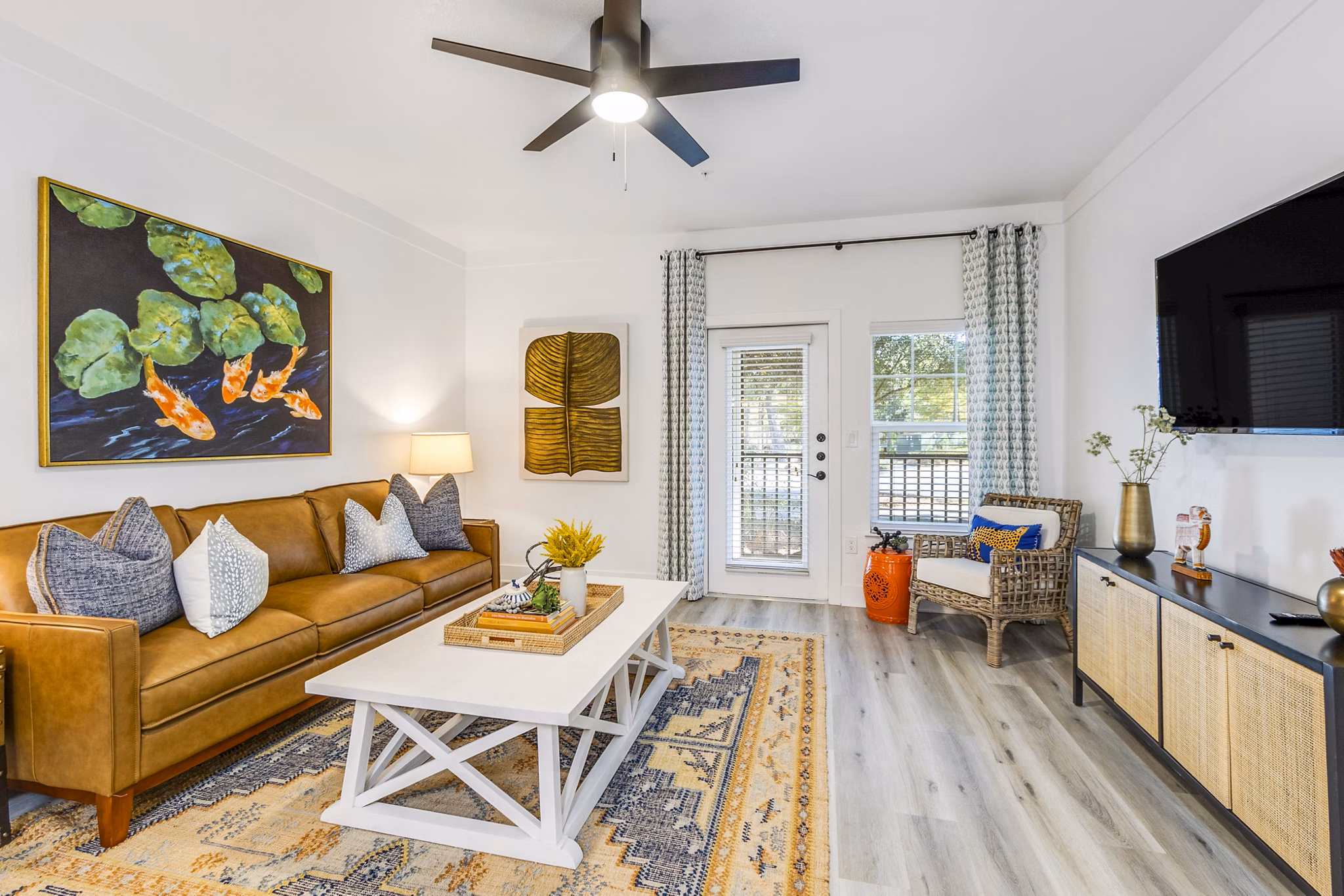 Contemporary living room with plush seating and natural light at The Avenues at Verdier Pointe Apartments