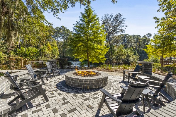 Patio with modern seating at The Avenues at Verdier Pointe Apartments offering luxury outdoor living spaces