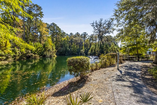 The Avenues at Verdier Pointe: Scenic view of luxury apartments nestled in a verdant setting