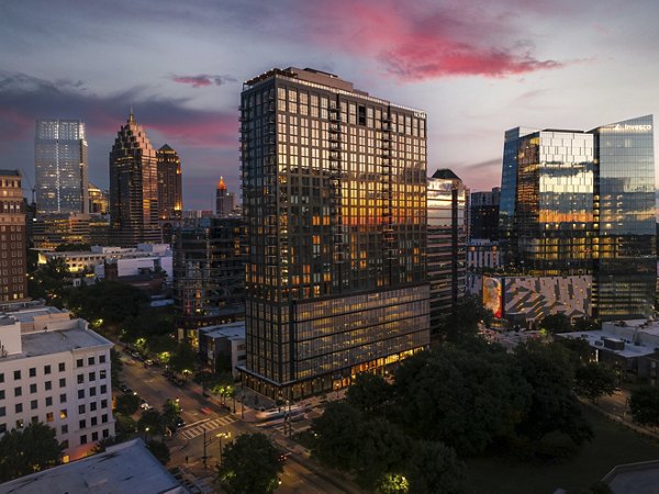 Nomia Apartments: Contemporary luxury apartment building with unique architectural design in vibrant downtown area