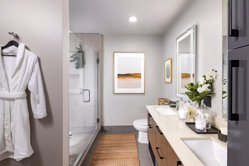 Bathroom featuring sleek fixtures and contemporary design in Nomia Apartments