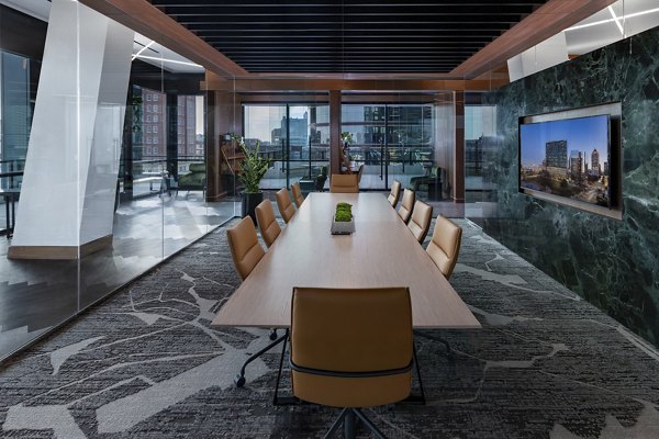 Modern clubhouse featuring a spacious seating area and elegant design at Nomia Apartments