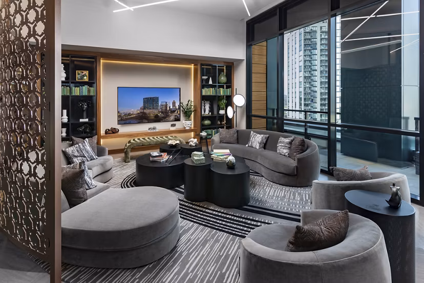 Clubhouse featuring modern design and cozy seating at Nomia Apartments