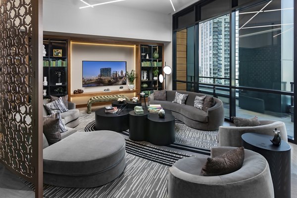 Clubhouse featuring modern design and cozy seating at Nomia Apartments
