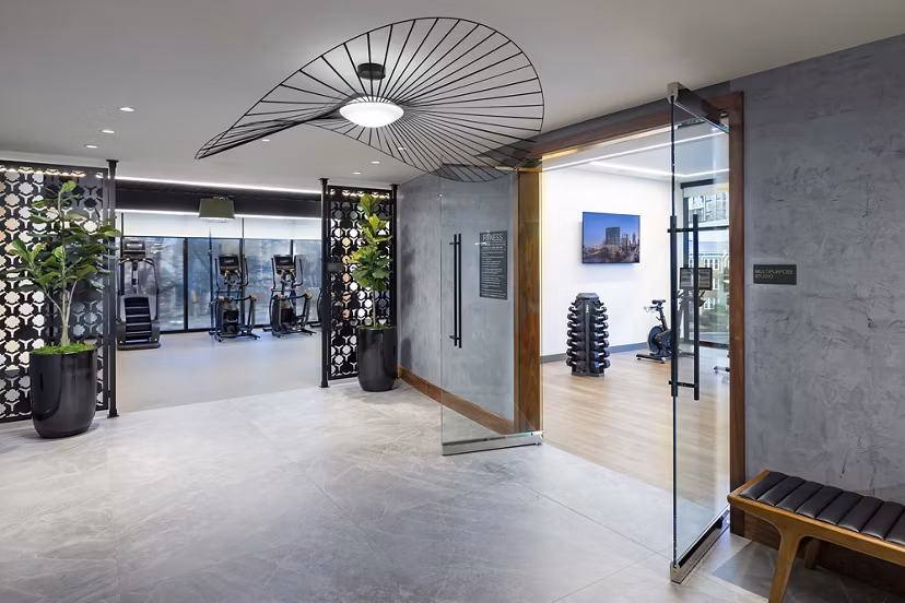 Nomia Apartments: Elegant clubhouse with modern design and comfortable seating areas for residents