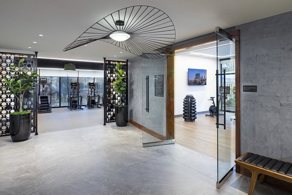 Nomia Apartments: Elegant clubhouse with modern design and comfortable seating areas for residents