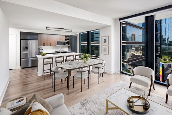 Dining area with elegant lighting and modern furnishings in Nomia Apartments