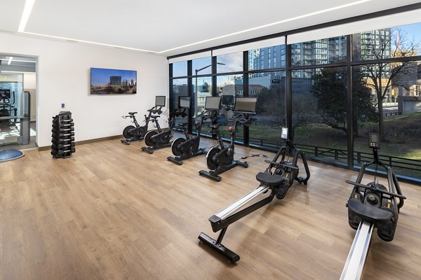 Modern fitness center equipped with state-of-the-art equipment at Nomia Apartments