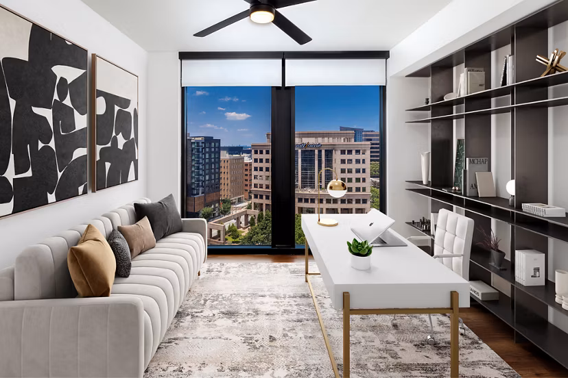 Home office with modern desk and ergonomic chair in Nomia Apartments