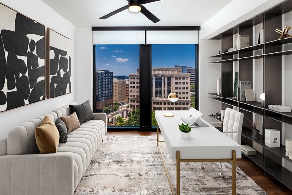 Home office with modern desk and ergonomic chair in Nomia Apartments