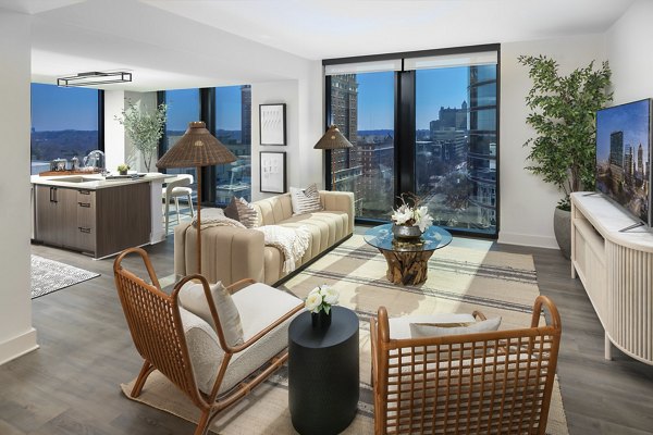 Spacious living room with contemporary furnishings at Nomia Apartments, featuring modern design and comfort in luxury living spaces