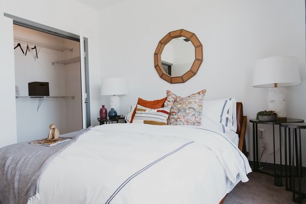 Cozy bedroom with modern decor at Tanager Apartments offering luxury living spaces